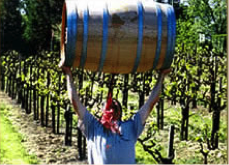 Mike Berthoud holds a barrel above his head